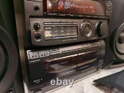 Système stéréo Hifi Sony MHC-771 avec lecteur 3 CD, deck cassette, radio et enceintes.